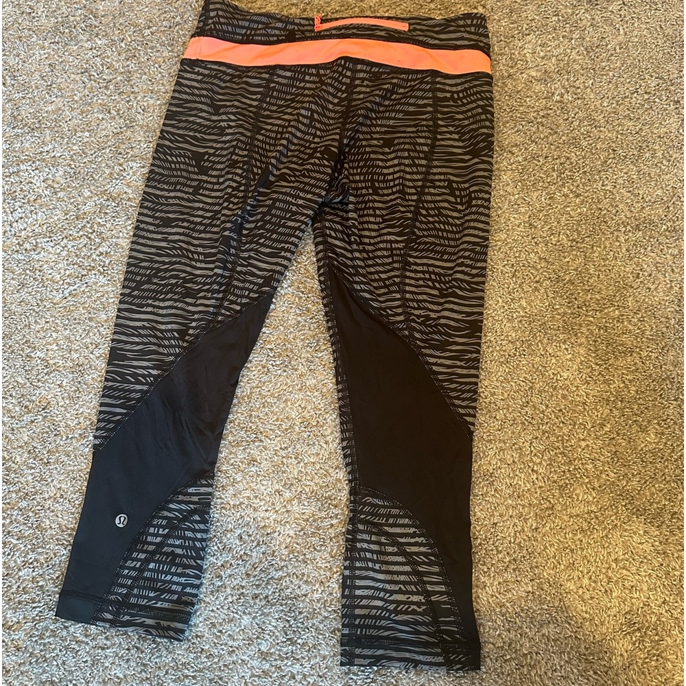 Lululemon leggings, size 8, black and pink.